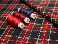 Plaid fabric with colored spools on top
